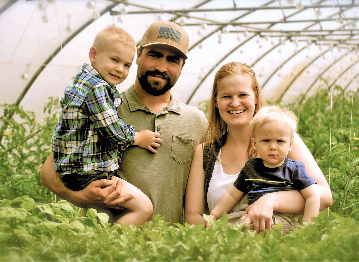 Luke and Melissa Wojcik, owners of Twin Elm Gardens, with their sons Henry and Griffin.